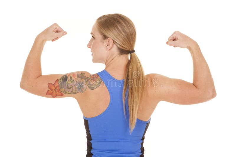 Fitness woman blue tank back flex look side stock images Fitness woman blue tank back flex look side stock images
