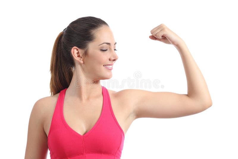 Fitness woman looking her biceps muscle isolated on a white background