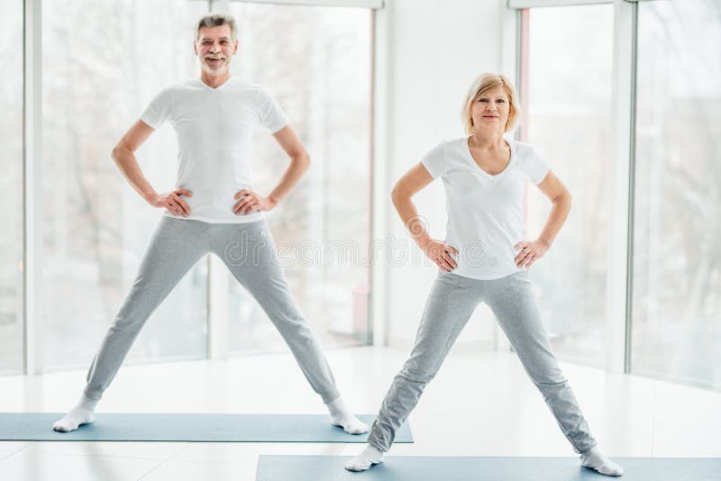 Daily Fitness Workout for Healthy Joints. Senior Couple Doing Fitness