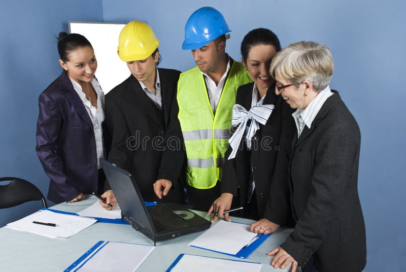 Five architects team in office working