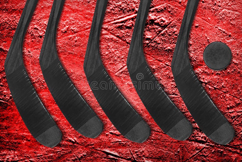 Hockey Black Stick and Puck on Ice by redgreystock