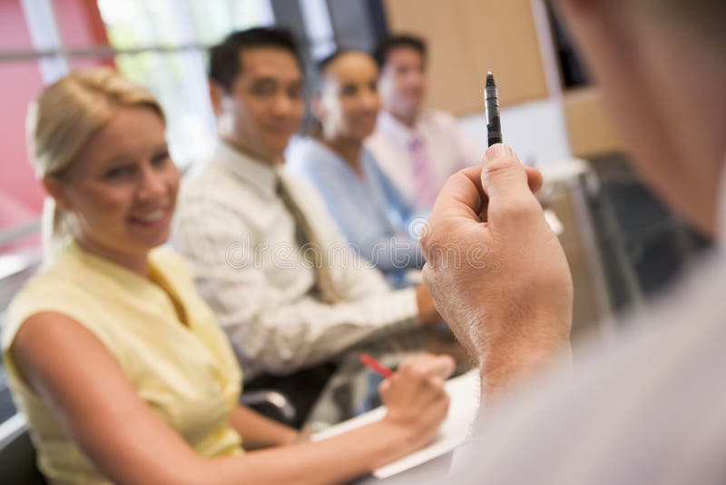 Business team in boardroom meeting. Boardroom table clapping stock images, royalty-free photos and pictures