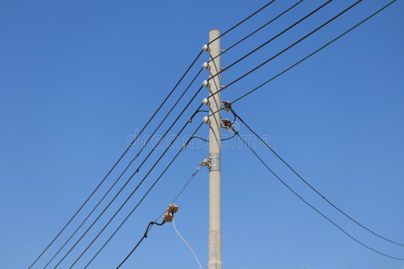 Five Electrical Cables on Pole in Malta Blue Sky Background Three