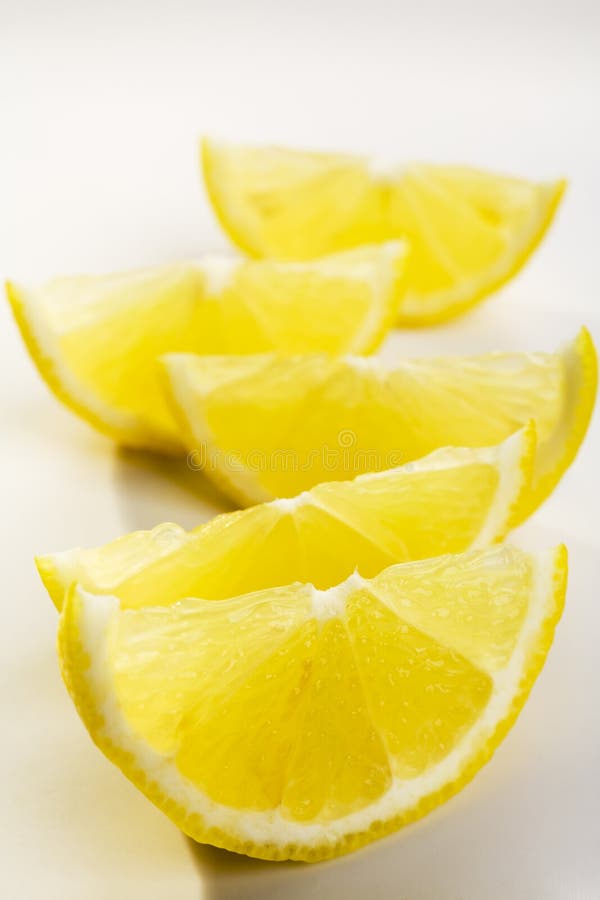 Lemon Wedges on White stock photos