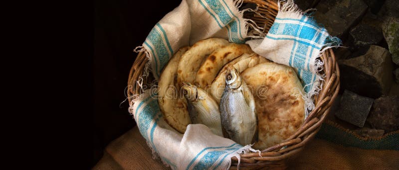 Five loaves and two fish in a basket