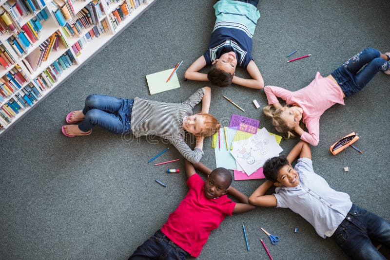 Happy children lying on floor royalty free stock photography Happy children lying on floor royalty free stock photography