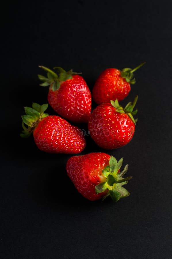 Five red strawberries