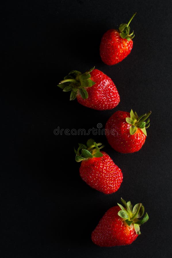 Five red strawberries