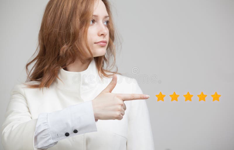 Five star rating or ranking, benchmarking concept. Woman assesses service, hotel, restaurant royalty free stock photography Five star rating or ranking, benchmarking concept. Woman assesses service, hotel, restaurant royalty free stock photography