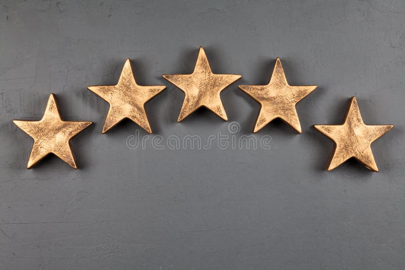 Five stars sign on dark background