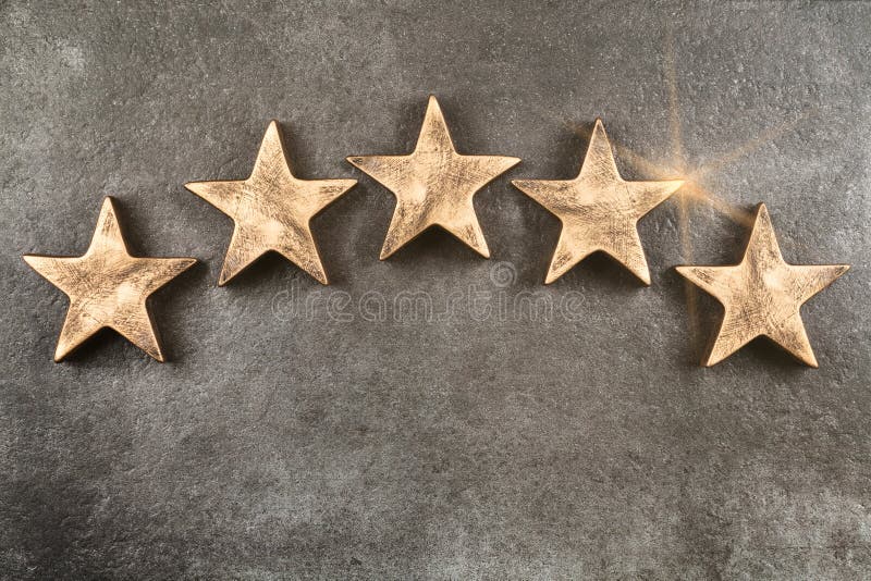 Five stars sign on dark background