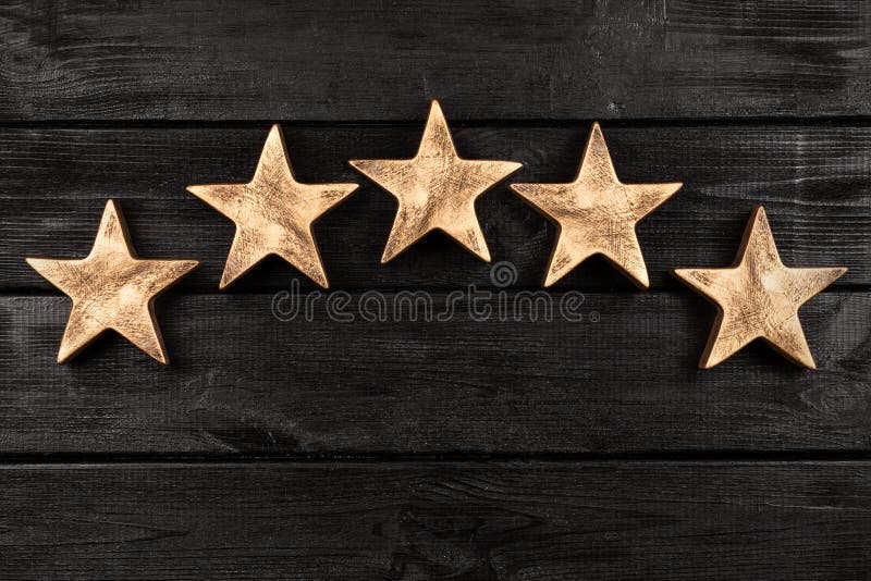 Five stars sign on dark background