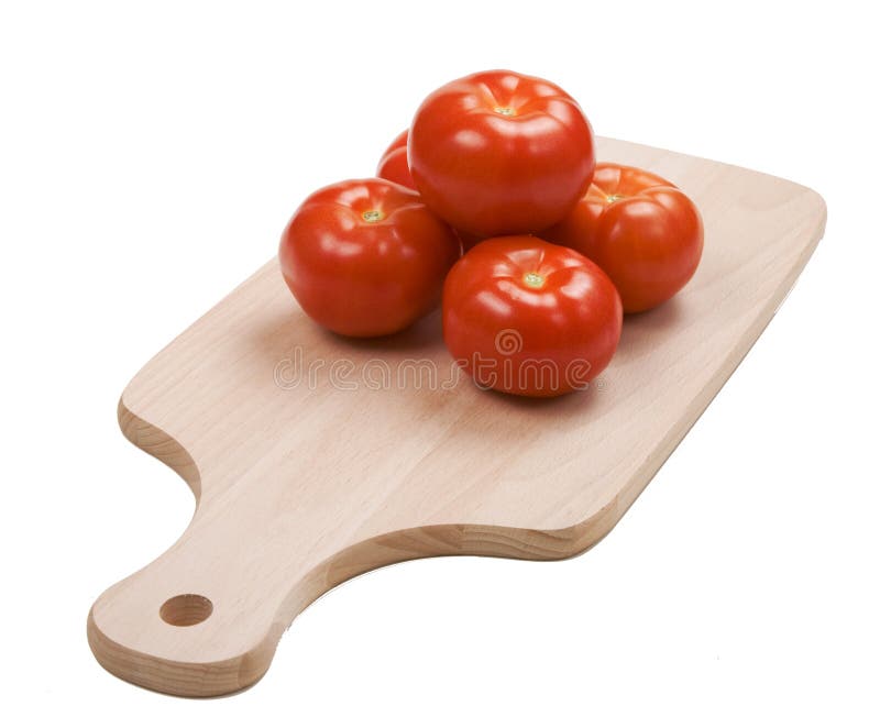 Five tomatoes pyramid on cutting board stock photos Five tomatoes pyramid on cutting board stock photos