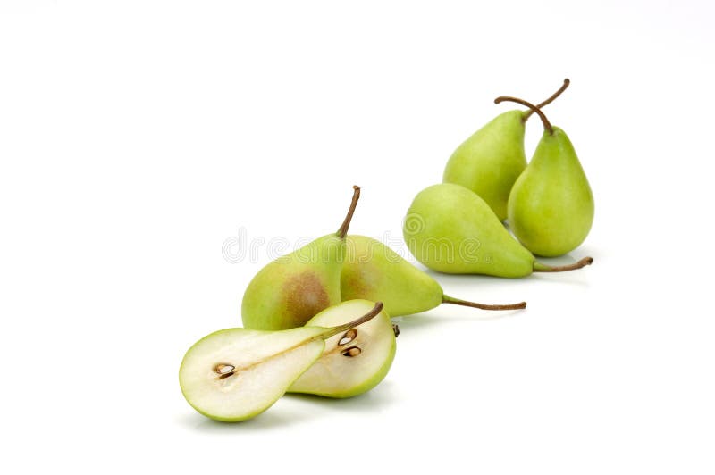 Five whole green pears and one halved