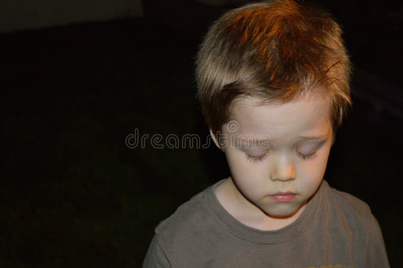 Download Sad boy outside at night stock photo. Image of bedtime - 106248952