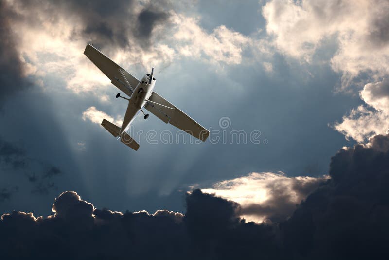 fixed wing plane against a stormy sky