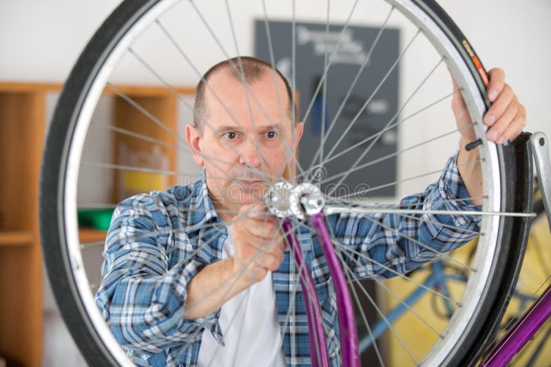 Fixing Bike Wheel in Storeeller Stock Image Image of seller