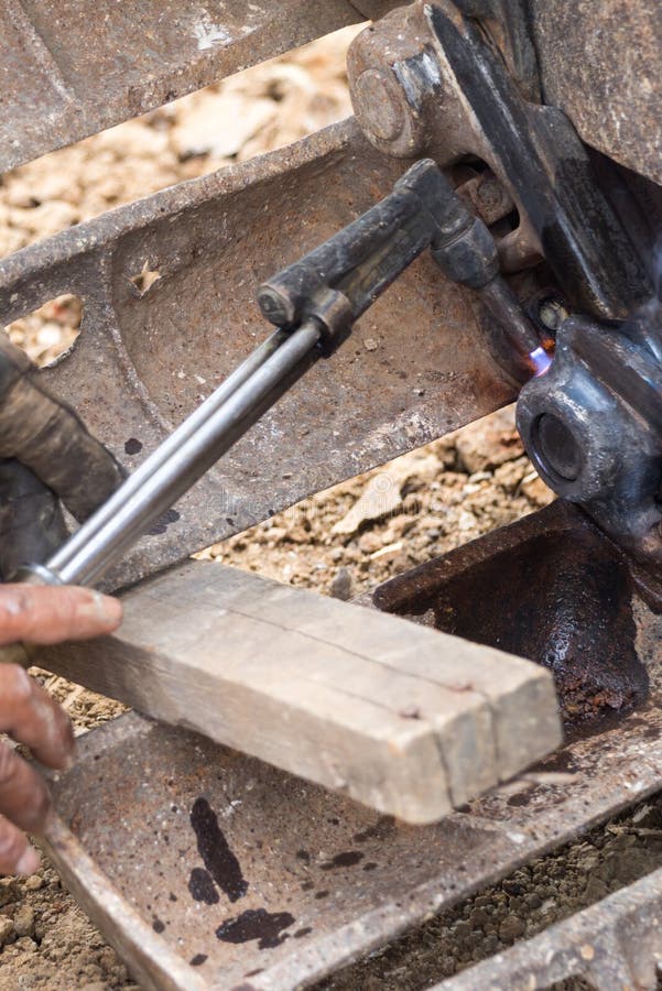 Fixing Bulldozer Wheel with Gas Cutting Torch Stock Photo - Image of