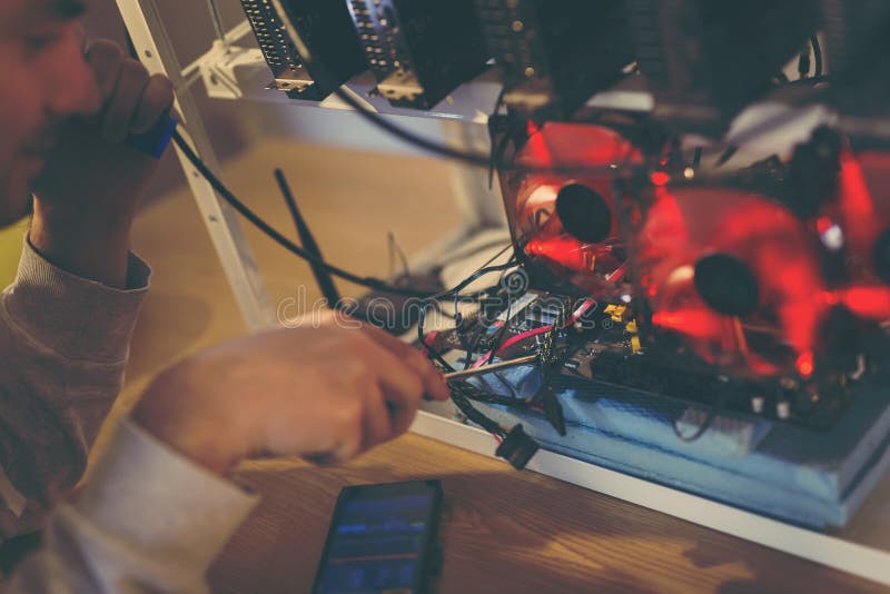 Fixing the mining rig stock image