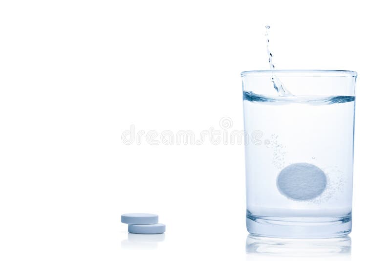 Fizzy pill splash in a glass of water.