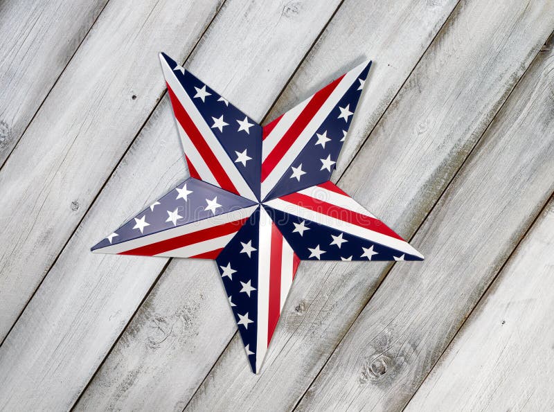 Fourth of July holiday star on rustic white wooden boards. Fourth of July holiday star on rustic white wooden boards.