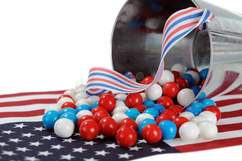 A pail of gummy ball candy in a Fourth of July decoration. A pail of gummy ball candy in a Fourth of July decoration