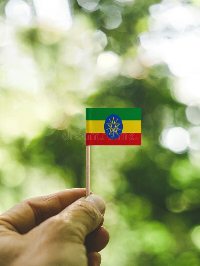 The Flag of the Ethiopia which is held in hand. royalty free stock photography
