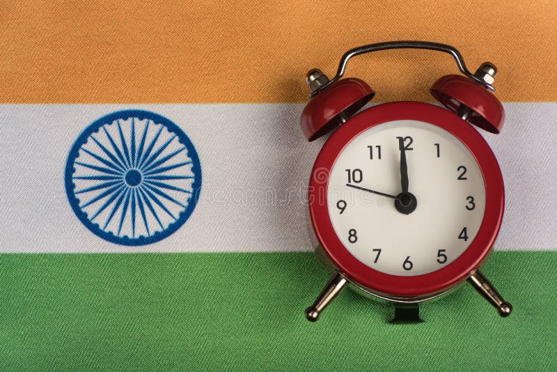Flag of India and the old alarm clock. Traveling to India. Time to learning Indian royalty free stock photos