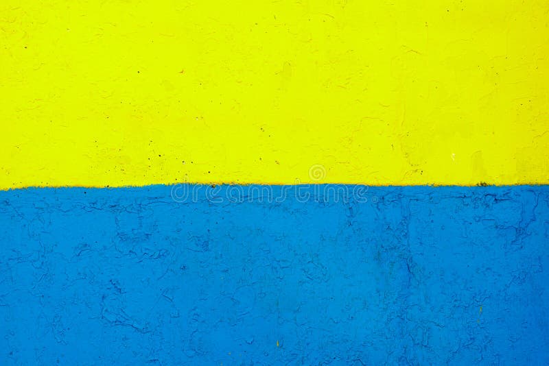 The Flag of Ukraine on the Fence. the Surface of the Concrete Fence is