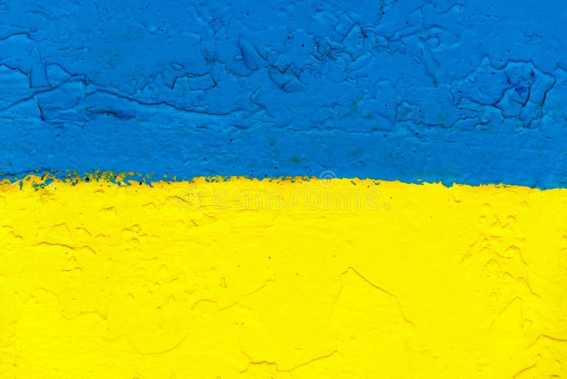 The Flag of Ukraine on the Fence. the Surface of the Concrete Fence is