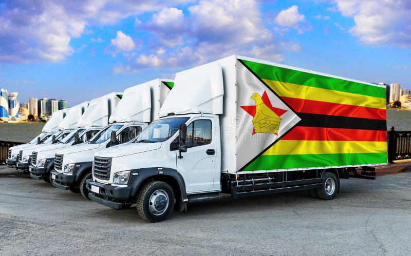 Flaga zimbabwe na tyłach pięciu nowych białych ciężarówek na tle rzeki i miasta. transport towarowy obrazy royalty free