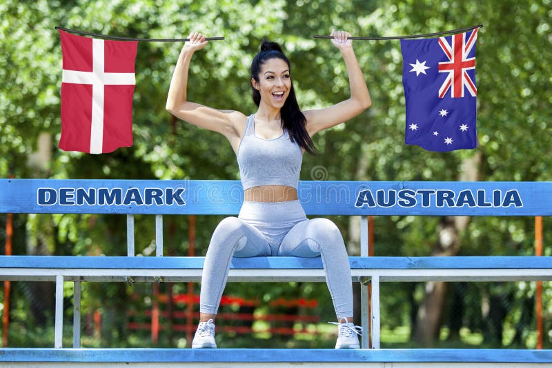 Flags of Denmark and Australia being held by beautiful girl royalty free stock photos Flags of Denmark and Australia being held by beautiful girl royalty free stock photos