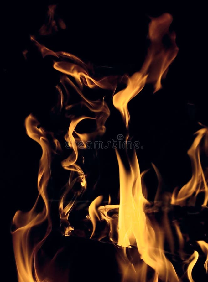 Yellow flame over black background. Plasma blast stock images, royalty-free photos and pictures