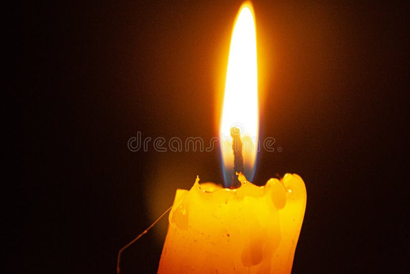 Flame of a Burning Candle Close Up. Candel Flame. Burning a Candle with