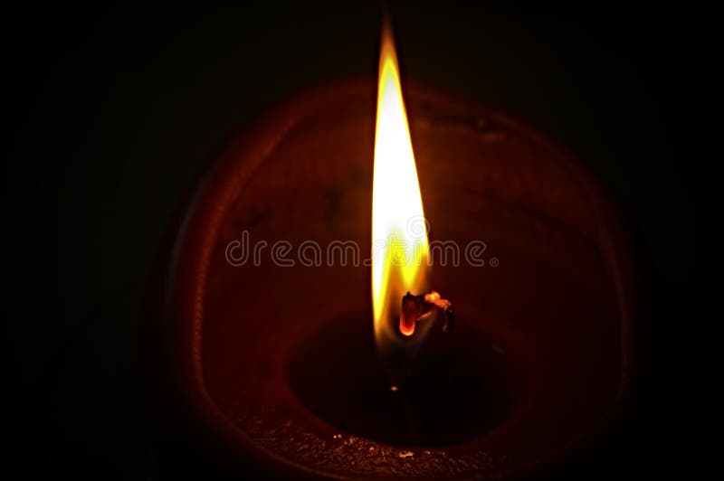 Flame of a candle in the dark stock photos Flame of a candle in the dark stock photos