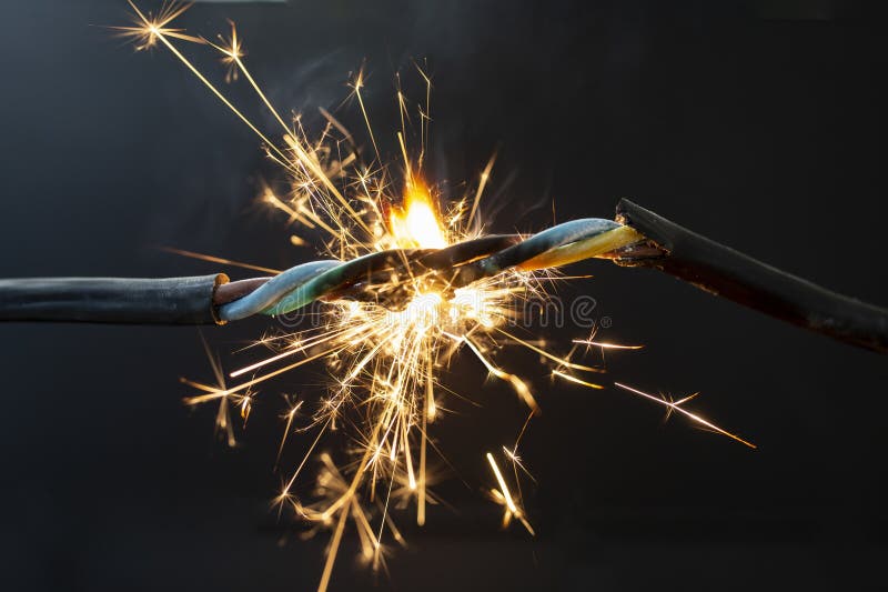Flame Smoke and Sparks on an Electrical Cable, Fire Hazard Concept Stock Photo Image of