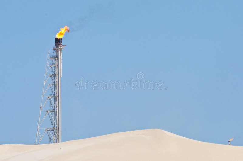 Flaming candle in the desert