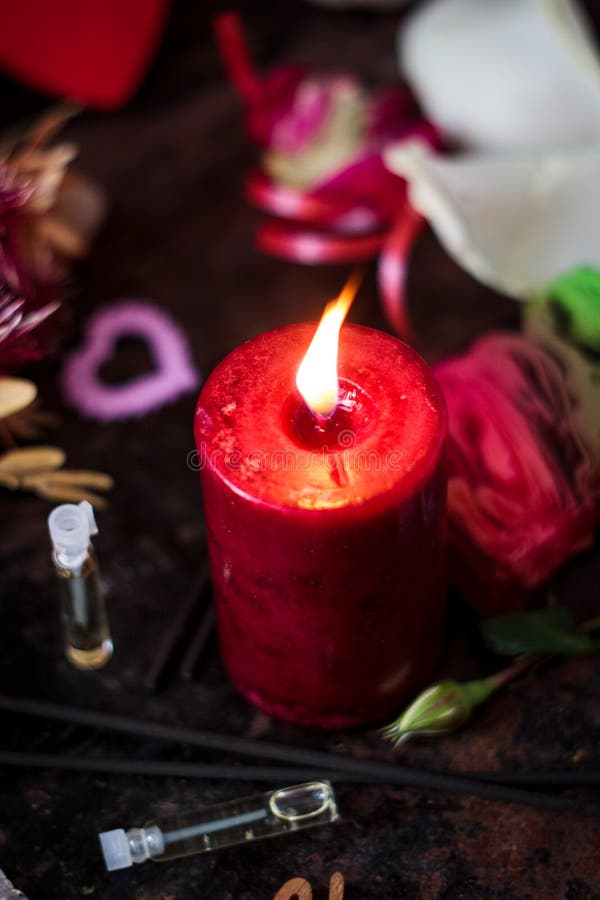 Candle Perfume And Cosmetic Bag In Shallow Depth Of Field On Blue