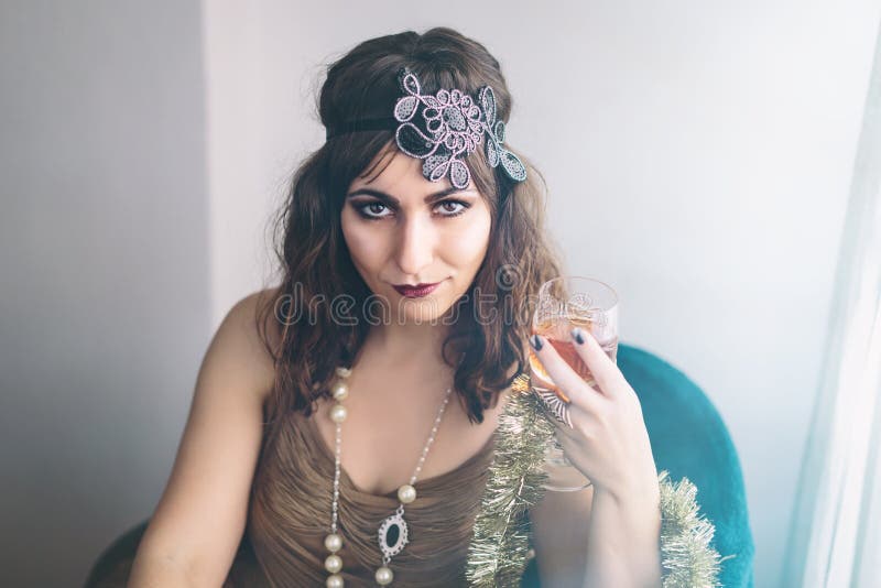 Flapper girl drinking a cocktail royalty free stock images Flapper girl drinking a cocktail royalty free stock images