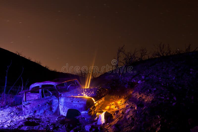 Flash Lit Old Car with Light Beams stock images
