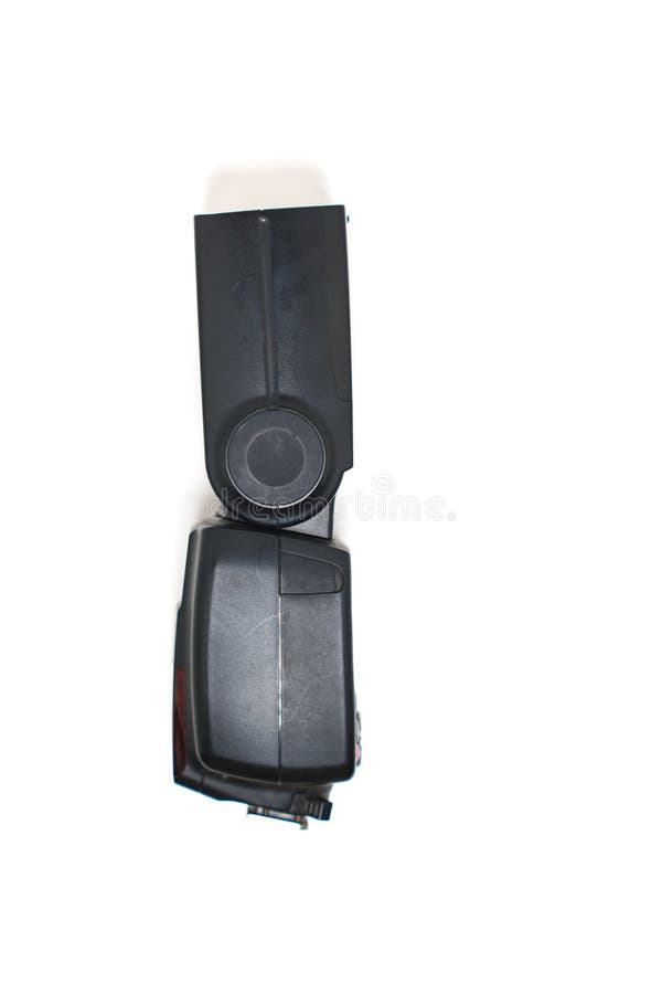 Flash unit for camera positioned vertically on a plain background stock photos