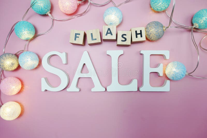 Flash - verkoop woord alfabet letter op roze achtergrond