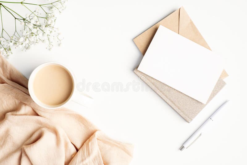 Flat lay blank paper letter card, plaid and cup of coffee on white desk. Hygge, autumn cozy mood, comfort concept stock photo Flat lay blank paper letter card, plaid and cup of coffee on white desk. Hygge, autumn cozy mood, comfort concept stock photo