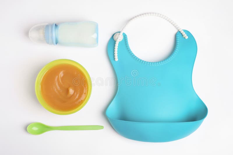 Flat Lay Composition with Baby Food and Accessories on Background Stock