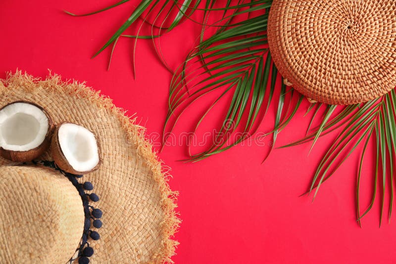 Flat lay composition with bamboo bag and straw hat on color background. Bright red hat stock images, royalty-free photos and pictures