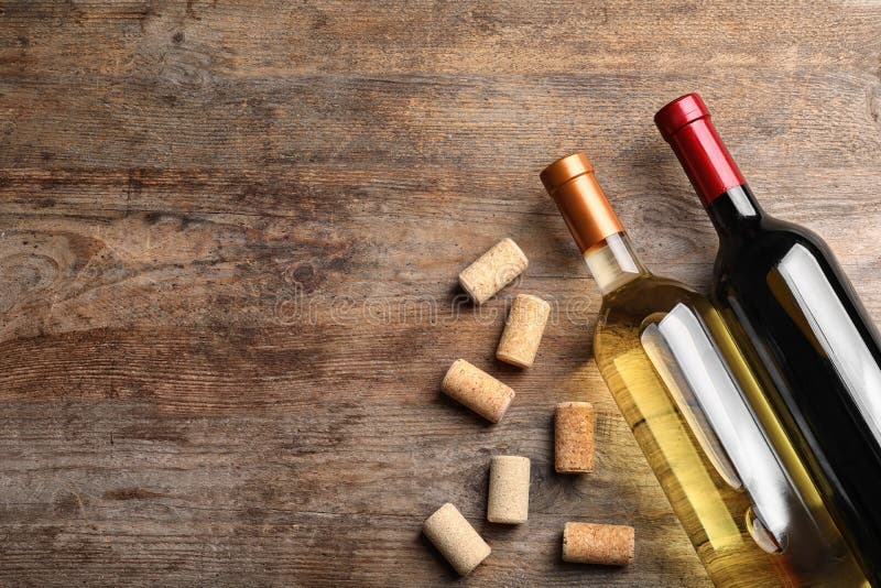 Flat Lay Composition with Bottles of Wine and Corks on Wooden Table. Space Stock Image Image