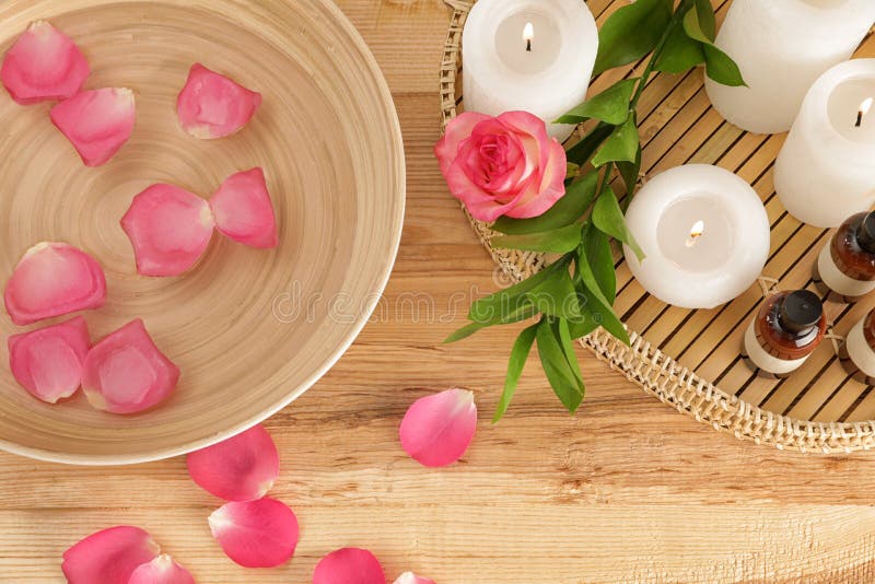 Flat lay composition with bowl of water, rose petals and candles. Spa treatment royalty free stock image Flat lay composition with bowl of water, rose petals and candles. Spa treatment royalty free stock image