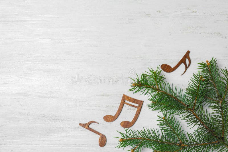 Flat lay composition with Christmas tree branch, music notes and space for text royalty free stock photography