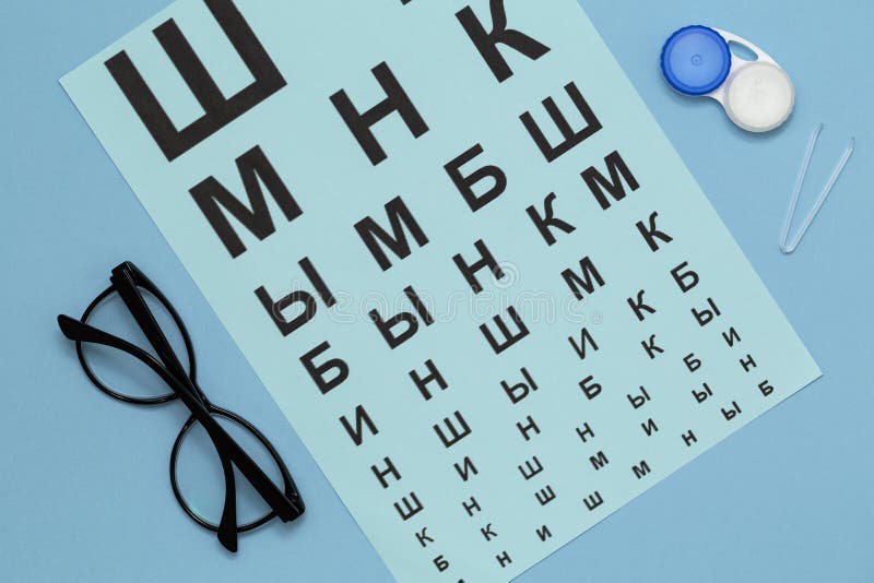 Flat lay composition with contact lenses, glasses and accessories on blue background. royalty free stock photos Flat lay composition with contact lenses, glasses and accessories on blue background. royalty free stock photos