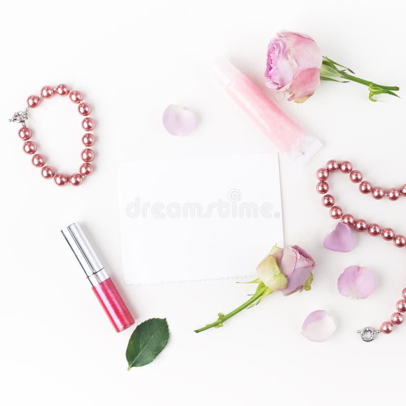Flat Lay Composition with Cosmetics and Pink Rose Flowers. Top View